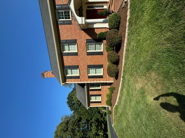 Well-maintained flower beds with trimmed borders